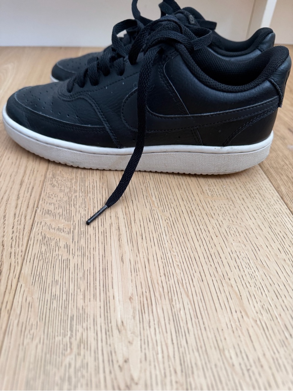 Nike ladies 7 Black Leather Low-Top Sneakers with White Sole